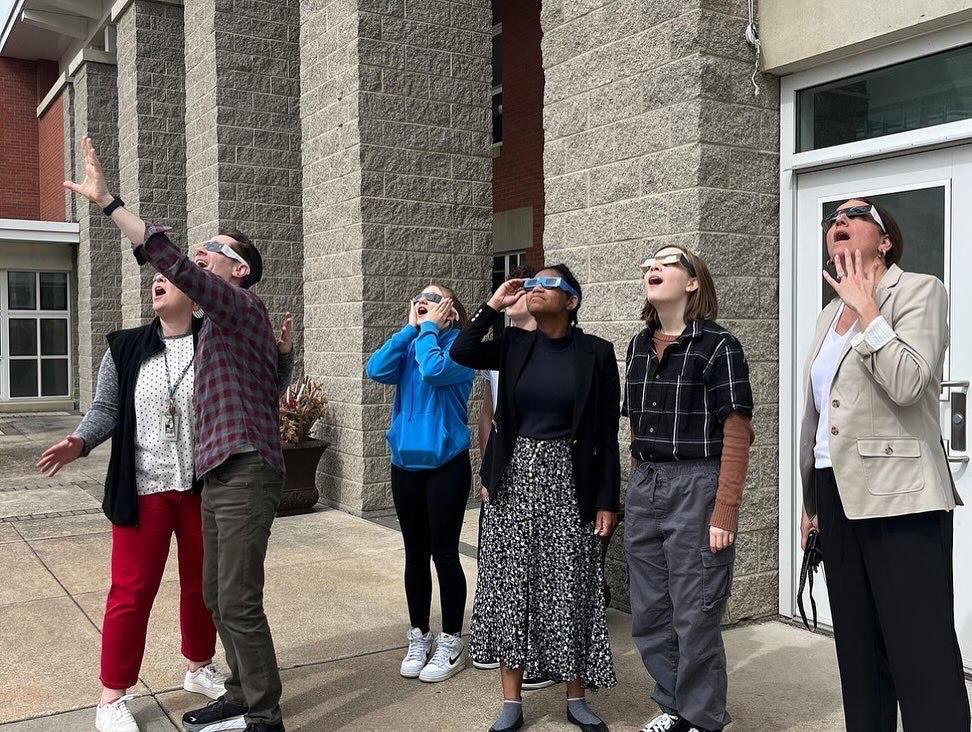 staff and students viewing solar eclipse